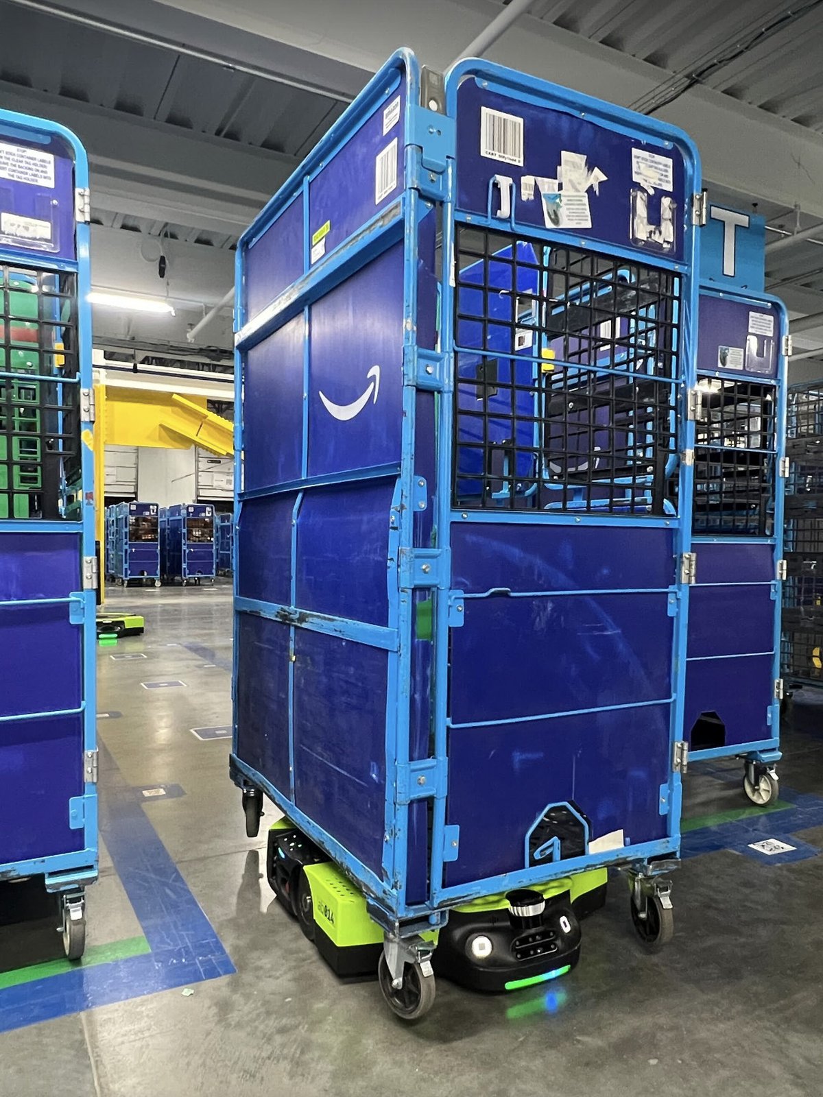 Carts staged for outbound loading in a Proteus-served area of a fulfillment center