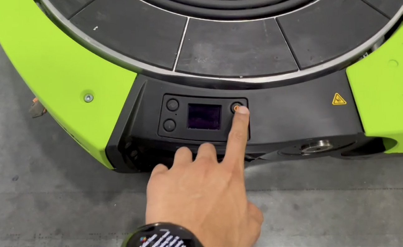 A Floor Monitor interacting with a Proteus bot — pressing the action button on the bot's control interface during a live issue
