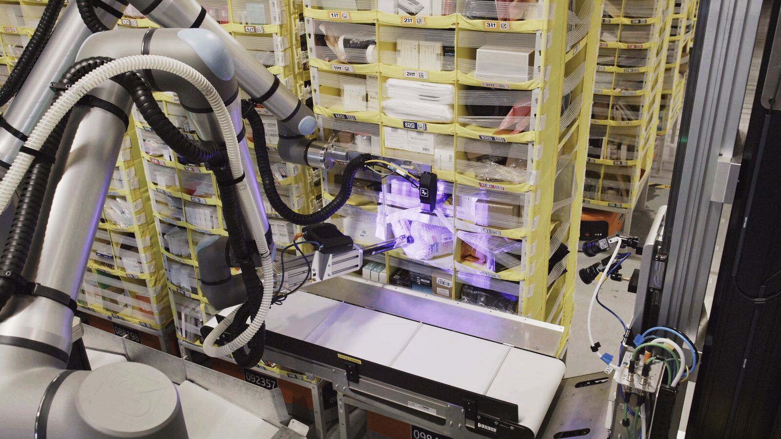 The Vulcan Stow workcell — robot arm and induct conveyor