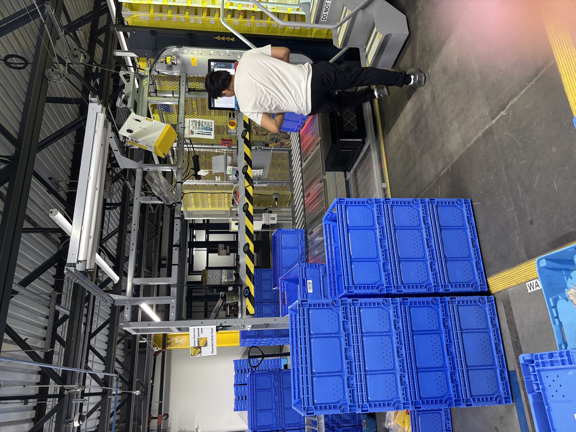 PS totes accumulating around an inventory-removal station
